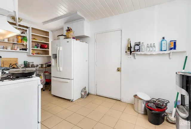 a view of a kitchen with appliances and cabinets
