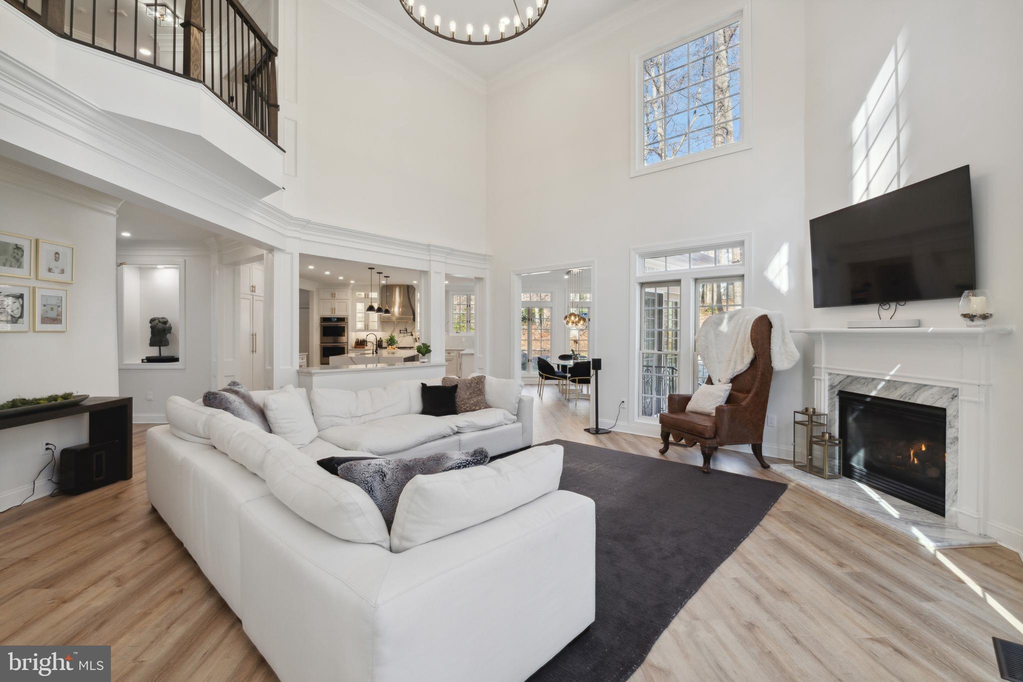 212 May Lane Edgewater, MD 21037 - Photo 17 of 68 Great room with gas fireplace open to kitchen