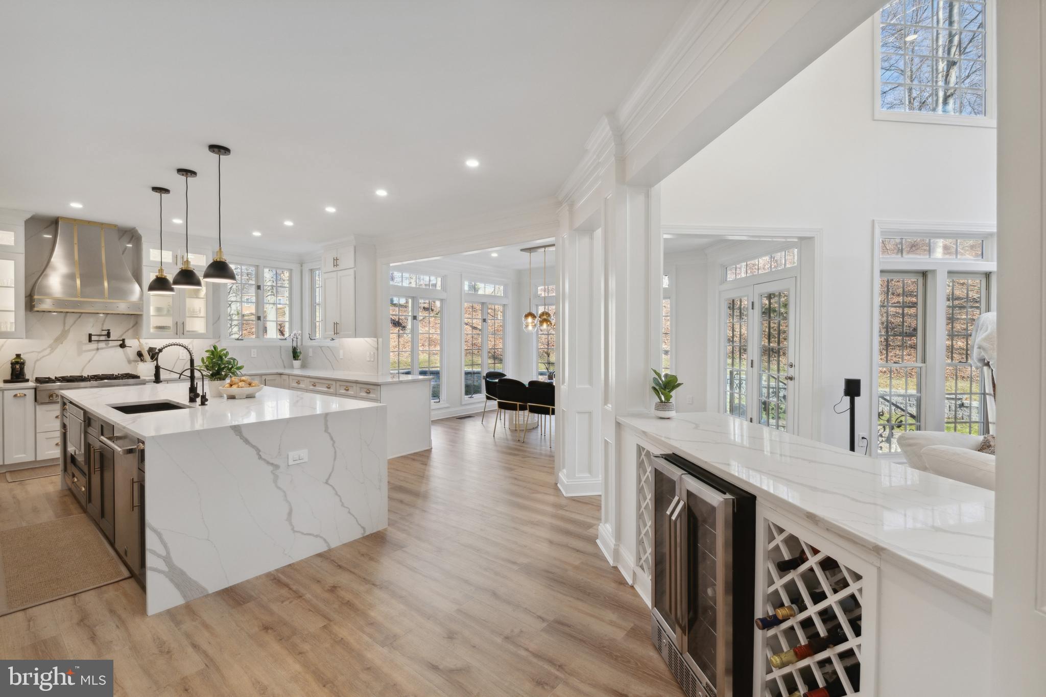 212 May Lane Edgewater, MD 21037 - Photo 22 of 68 Built in wine racks and beverage fridge in kitchen