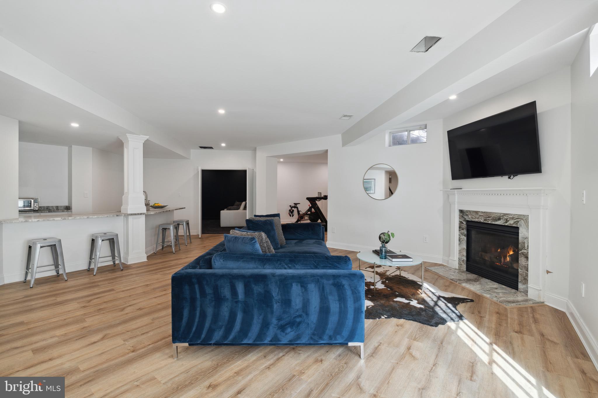 212 May Lane Edgewater, MD 21037 - Photo 43 of 68 Basement Rec Room with fireplace & French doors