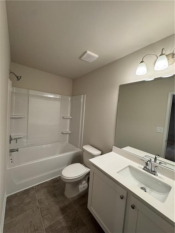 11 Huntley Trace Hoschton, GA 30548 - Photo 11 of 12 a bathroom with a sink a toilet and shower