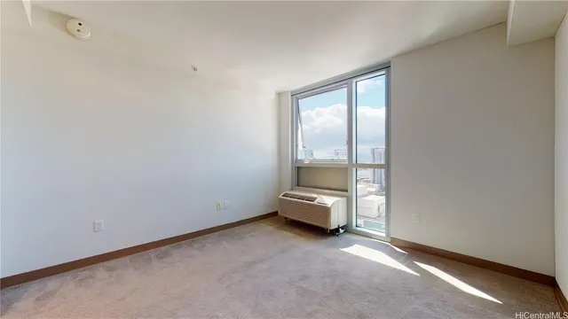 an empty room with floor to ceiling window