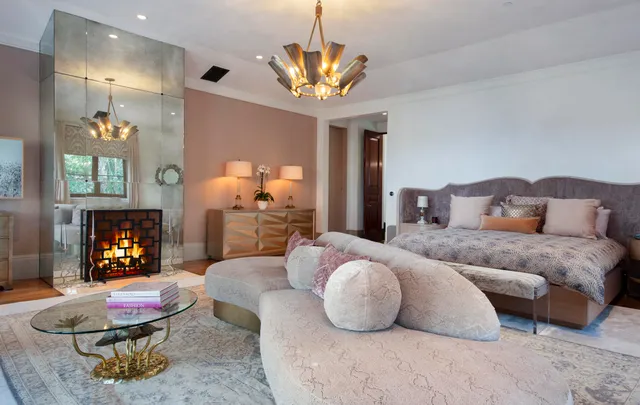 a bedroom with furniture and a chandelier