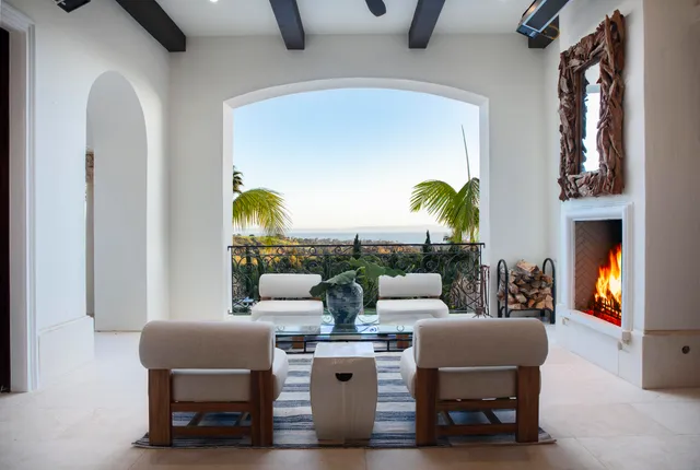 a living room with furniture a lamp and a fireplace
