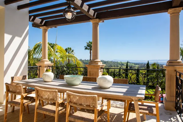 a view of a dining table with chairs