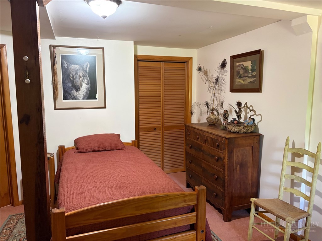 873 Silverleaf Road Zionville, NC 28698 - Photo 33 of 49 a bedroom with a bed and furniture