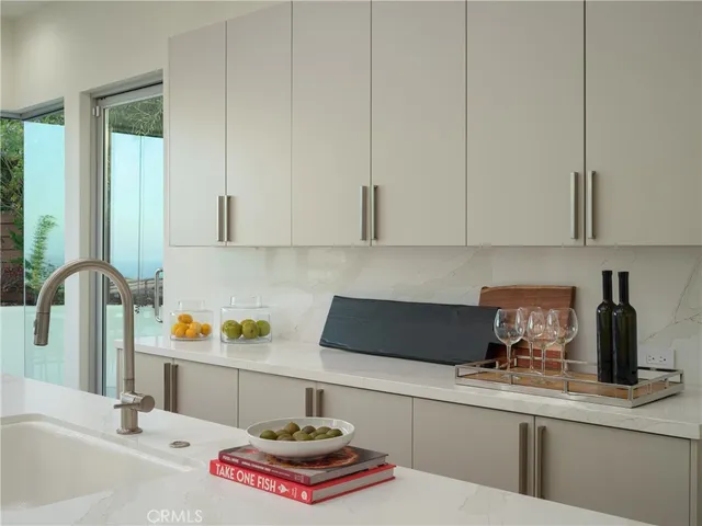a kitchen with a sink and cabinets