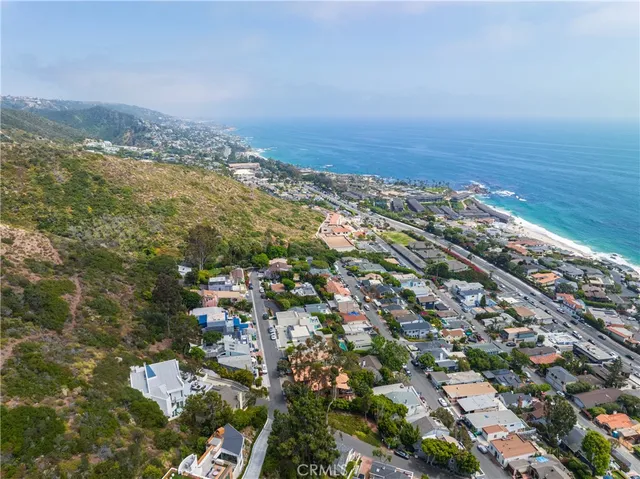 an aerial view of residential building and ocean