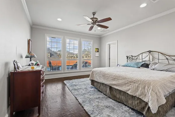 a bedroom with a large bed and a window