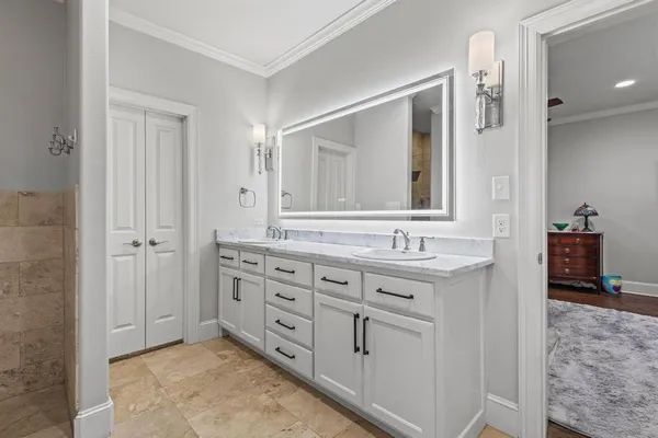 a bathroom with a granite countertop sink mirror and