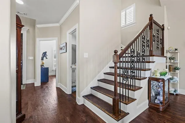 a view of entryway with wooden floor and stairs