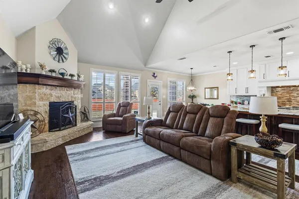 a living room with furniture and a fireplace