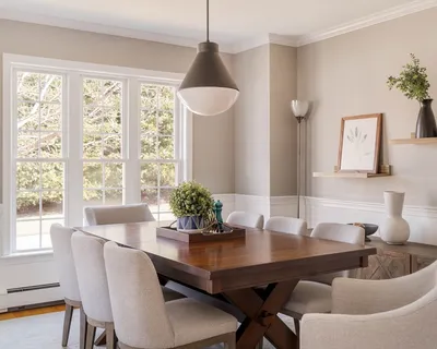 a dining room with furniture and window