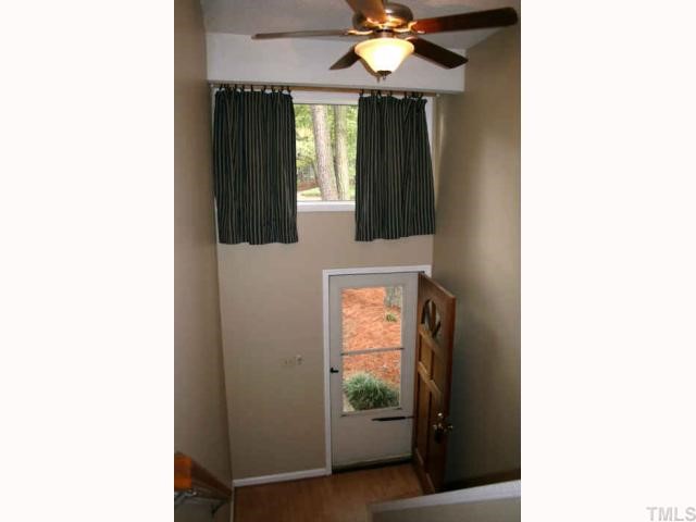 a bathroom with a mirror and a window