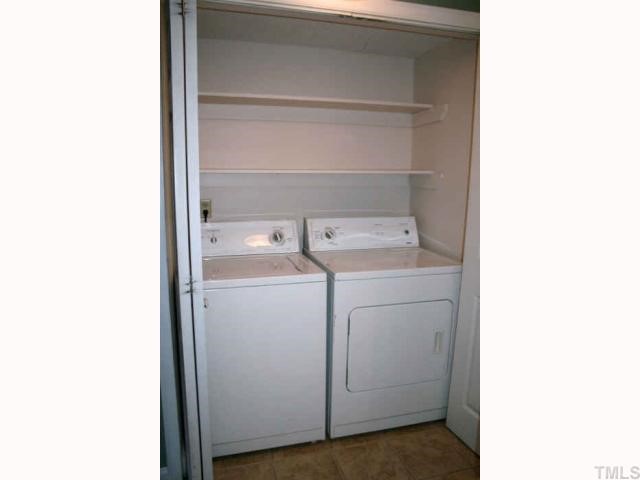 705 Godwin Court Raleigh, NC 27606 - Photo 4 of 11 a utility room with dryer and washer