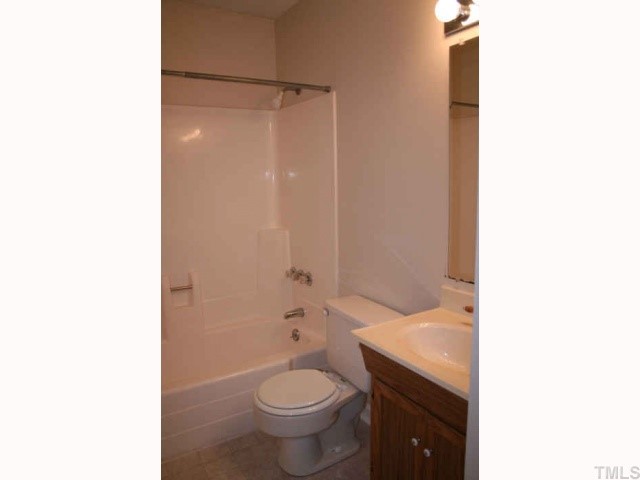 705 Godwin Court Raleigh, NC 27606 - Photo 7 of 11 a bathroom with a sink and a toilet