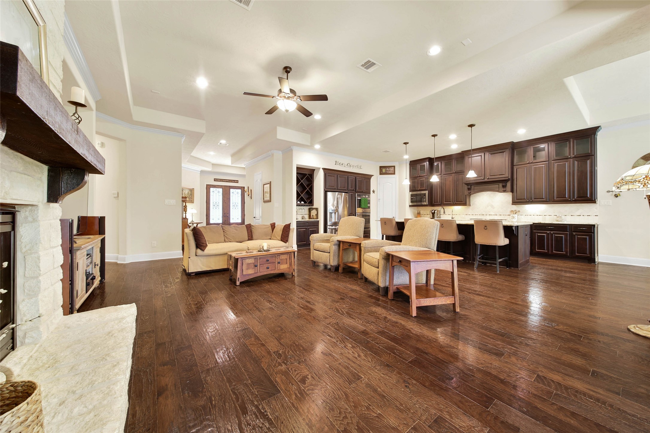 3234 Explorer Way Conroe, TX 77301 - Photo 21 of 46 Hand-scraped hardwood floors and soaring ceilings enhance the home's spacious feel.