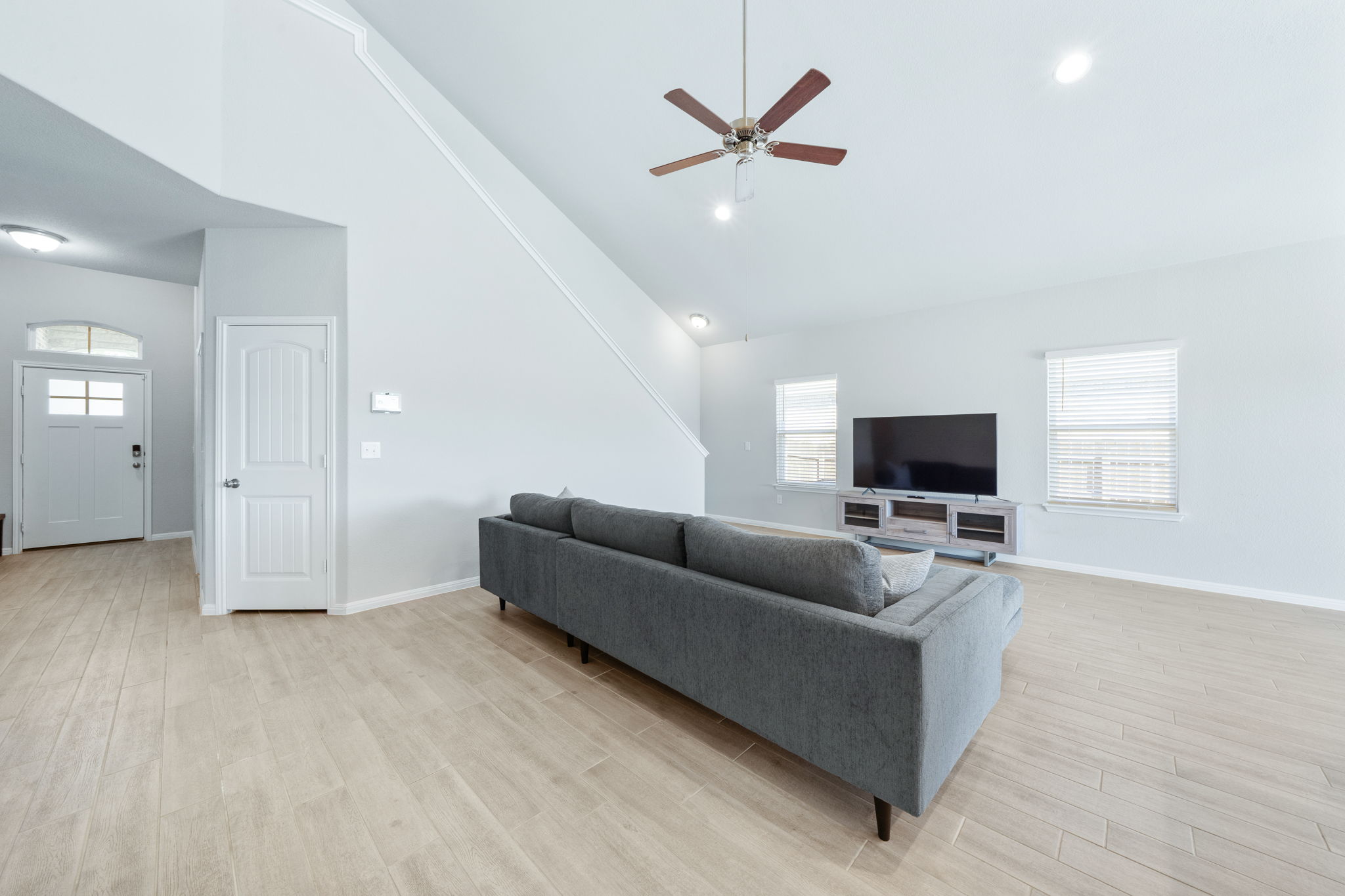 2412 Starhill Ranch Street Georgetown, TX 78628 - Photo 12 of 40 A comfortable living area with light-toned flooring offers an inviting atmosphere.