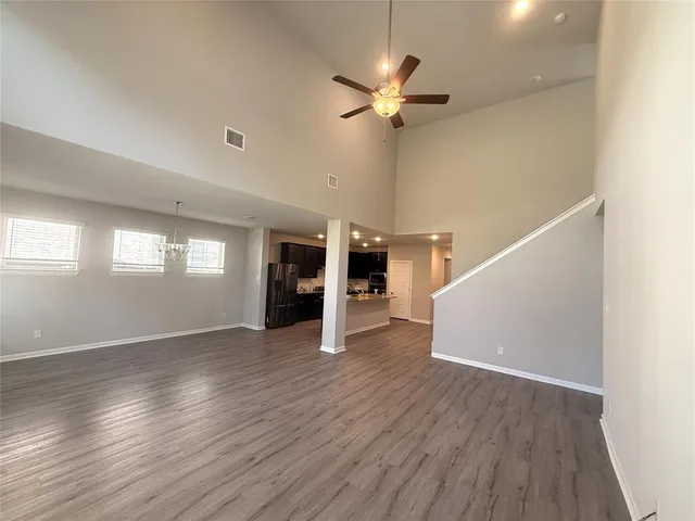 a large kitchen with a large counter top appliances and cabinets