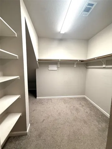 a bathroom with a sink mirror and a shower