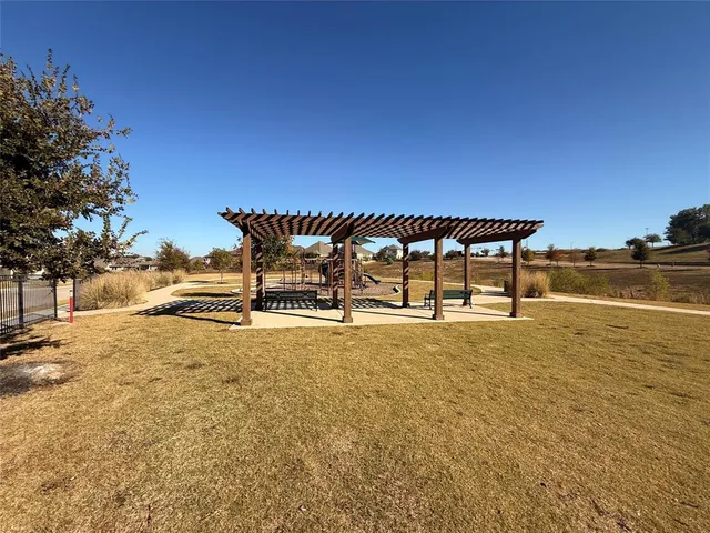 a house with swimming pool in front of it