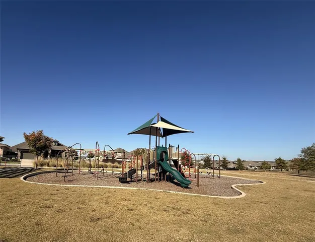 a swimming pool with an outdoor seating and a balcony