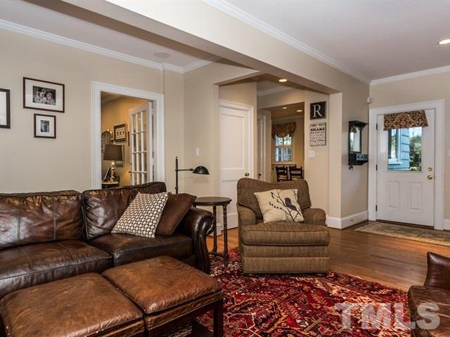 1506 Pineview Street Raleigh, NC 27608 - Photo 12 of 25 a living room with furniture and wooden floor