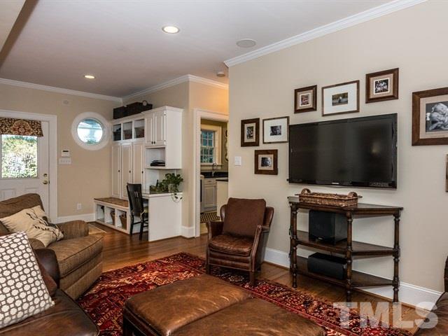 1506 Pineview Street Raleigh, NC 27608 - Photo 13 of 25 a living room with furniture and a flat screen tv