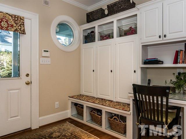 1506 Pineview Street Raleigh, NC 27608 - Photo 14 of 25 a view of a room with rack and wooden cabinets