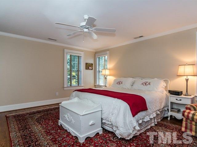 1506 Pineview Street Raleigh, NC 27608 - Photo 15 of 25 a bedroom with a bed and window