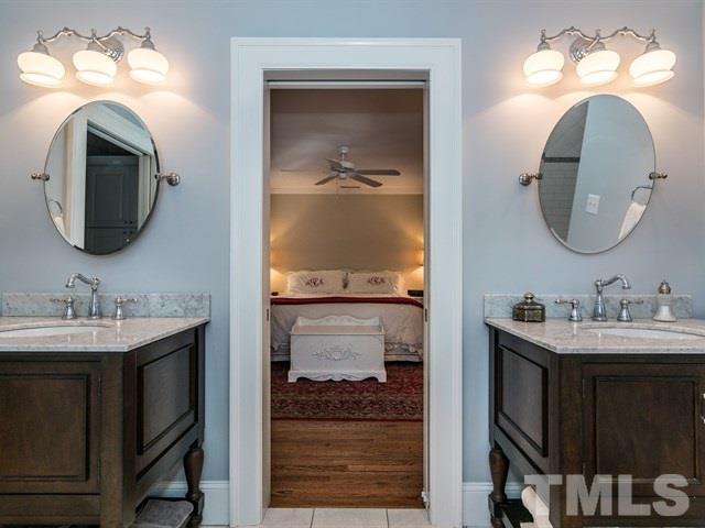 1506 Pineview Street Raleigh, NC 27608 - Photo 16 of 25 a bathroom with a sink and a mirror