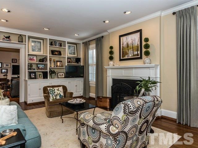 1506 Pineview Street Raleigh, NC 27608 - Photo 3 of 25 a living room with furniture and a fireplace