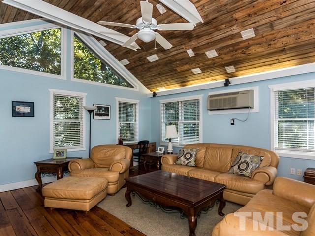 1506 Pineview Street Raleigh, NC 27608 - Photo 22 of 25 a living room with furniture and a large window