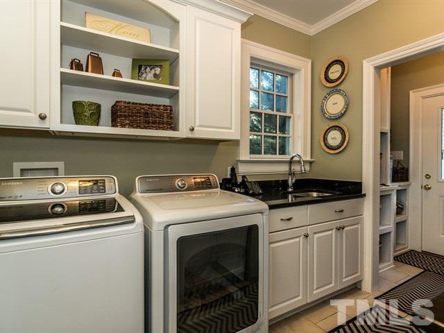 1506 Pineview Street Raleigh, NC 27608 - Photo 23 of 25 a utility room with washer and dryer