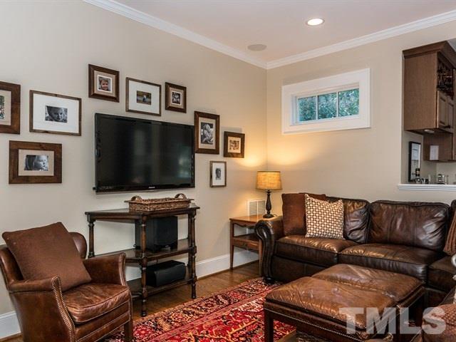 1506 Pineview Street Raleigh, NC 27608 - Photo 10 of 25 a living room with furniture and a flat screen tv
