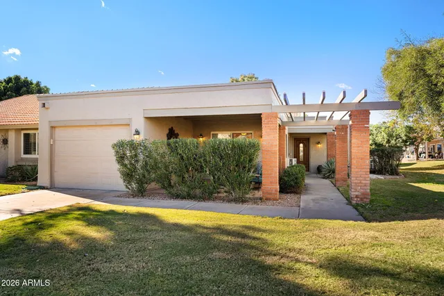 a outdoor living space with furniture and a garden