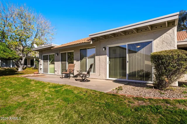 a view of a porch with wooden floor and stairs