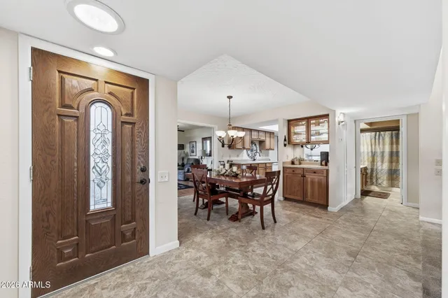 a view of a dining room with furniture window and outside view