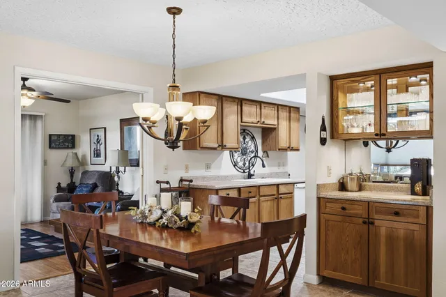 a kitchen with a sink refrigerator and cabinets