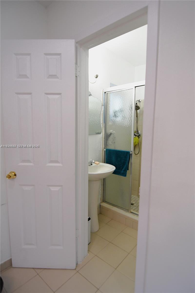 1014 West 68th Street Hialeah, FL 33014 - Photo 20 of 40 a bathroom with a sink and toilet