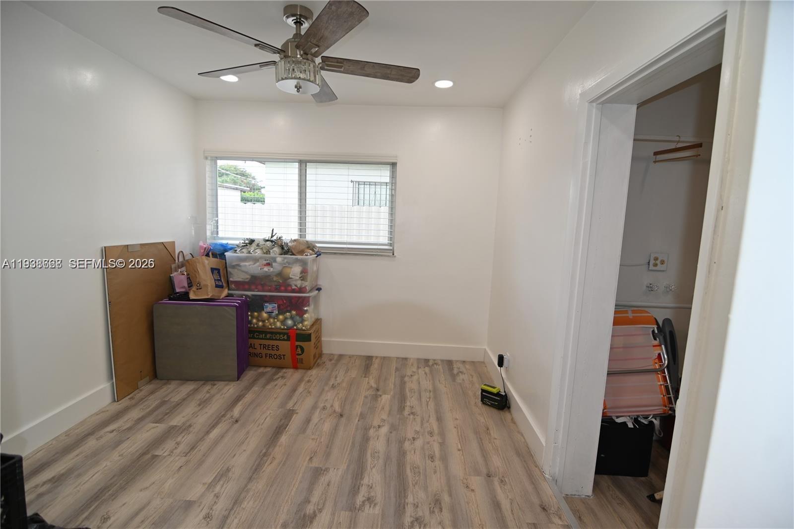 1014 West 68th Street Hialeah, FL 33014 - Photo 23 of 40 wooden floor and dining room with furniture