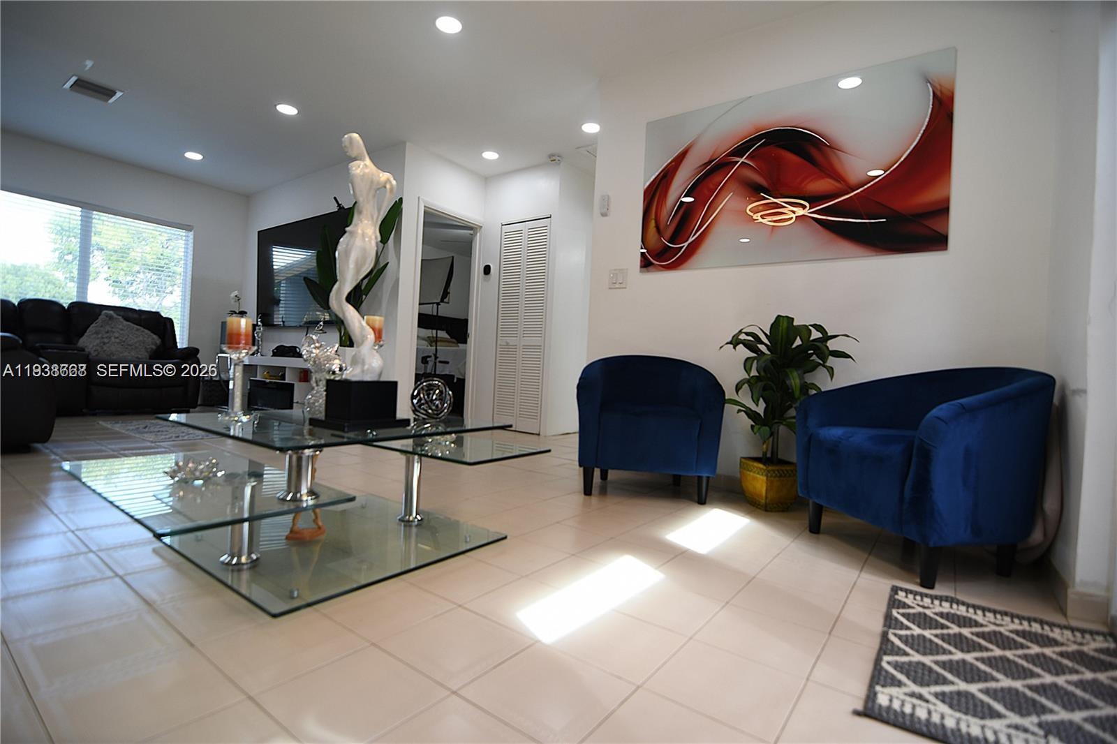 1014 West 68th Street Hialeah, FL 33014 - Photo 9 of 40 a living room with furniture