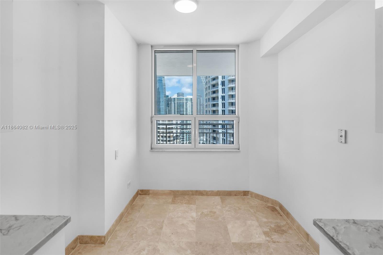 808 Brickell Key Drive, Unit 3205 Miami, FL 33131 - Photo 15 of 51 an empty room with windows