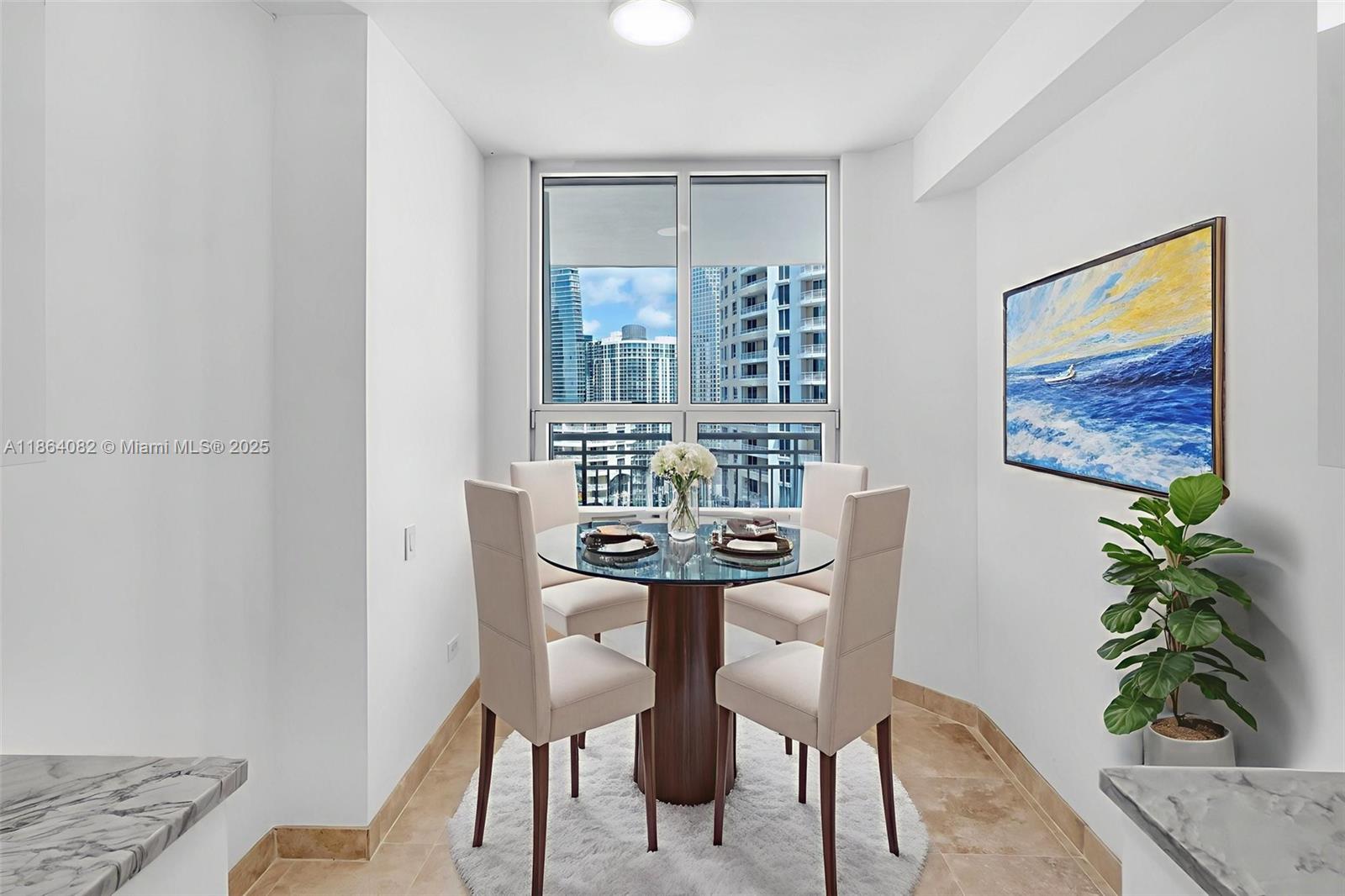 808 Brickell Key Drive, Unit 3205 Miami, FL 33131 - Photo 16 of 51 a view of a dining room with furniture and wooden floor