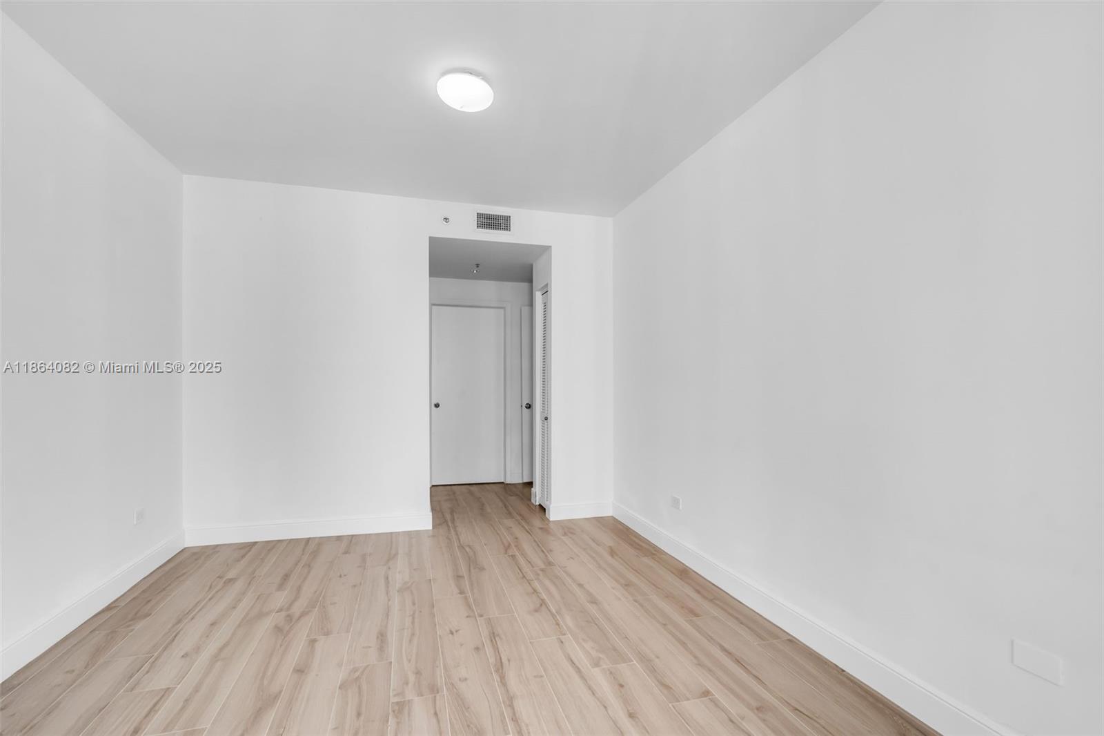 808 Brickell Key Drive, Unit 3205 Miami, FL 33131 - Photo 19 of 51 a view of a room with wooden floor