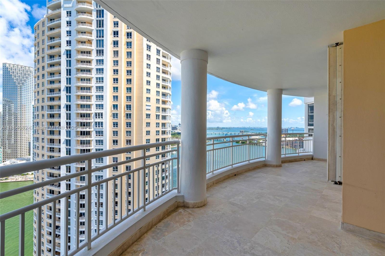 808 Brickell Key Drive, Unit 3205 Miami, FL 33131 - Photo 2 of 51 a view of a hallway with windows
