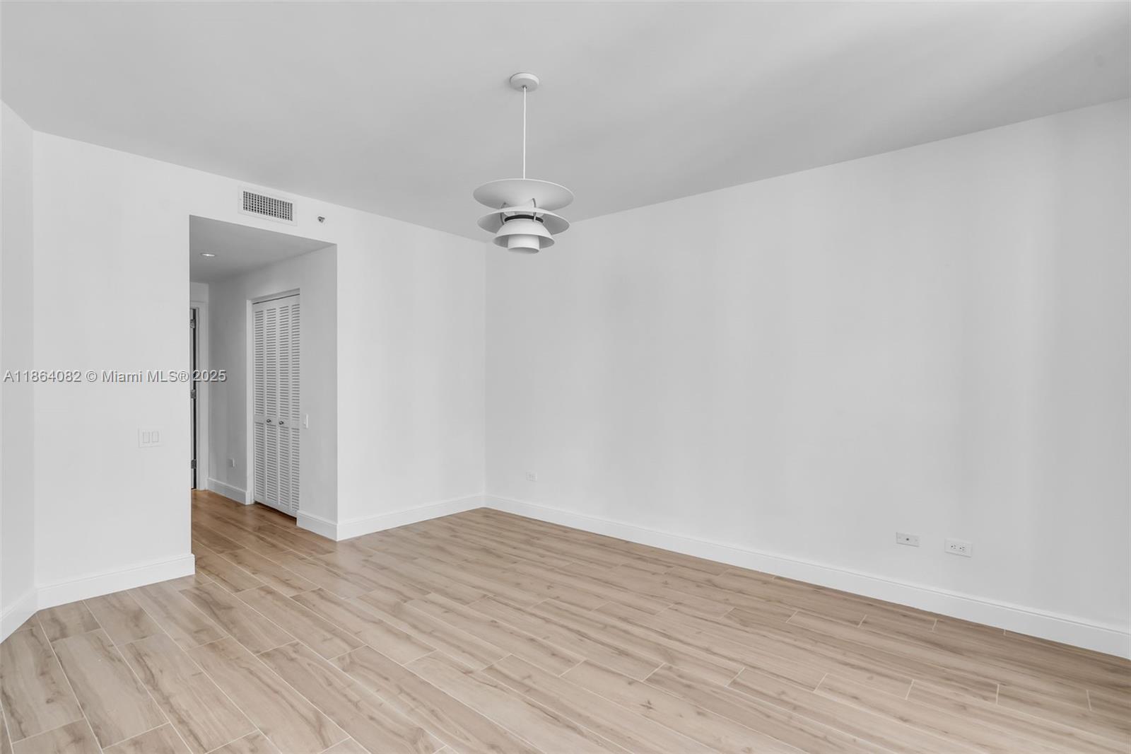 808 Brickell Key Drive, Unit 3205 Miami, FL 33131 - Photo 28 of 51 a view of a room with wooden floor