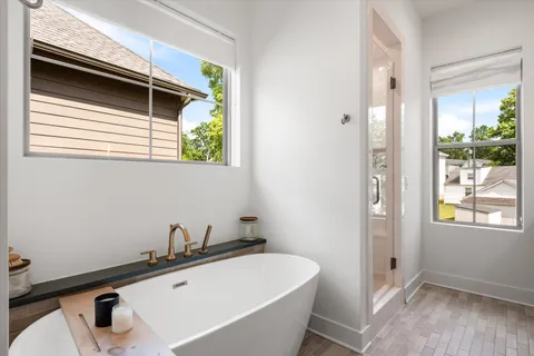 a bedroom with a bed and a desk