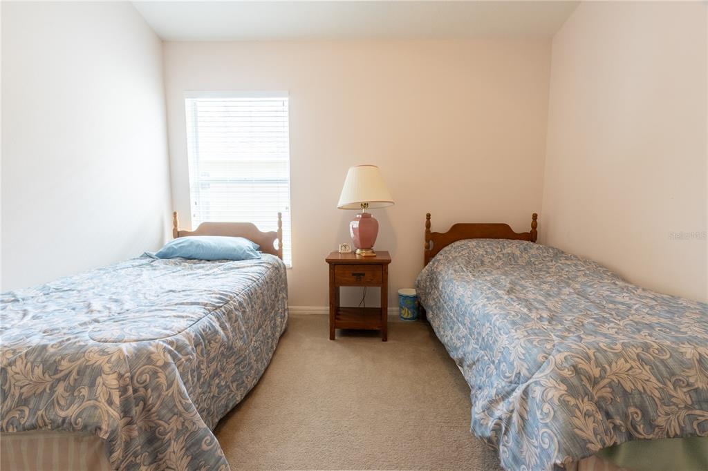 1812 Flower Branch Way Valrico, FL 33594 - Photo 23 of 42 a bedroom with a bed and a window
