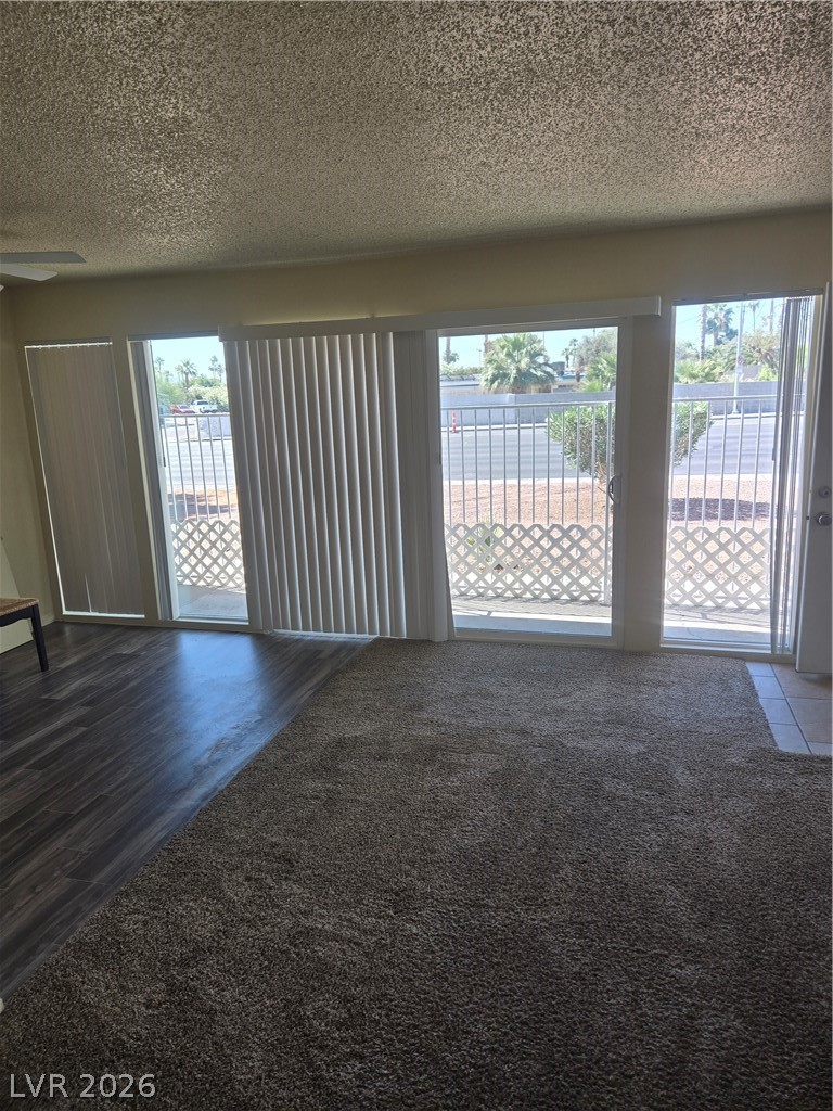 1388 East Desert Inn Road, Unit 2 Las Vegas, NV 89169 - Photo 4 of 23 This naturally illuminated living space offers a smooth transition to an outdoor balcony, ideal for leisure.